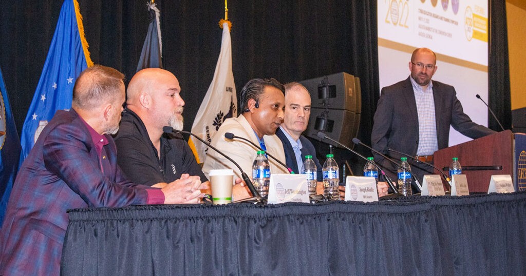 Sky Sharma (third from left) speaks at CERTS 2022